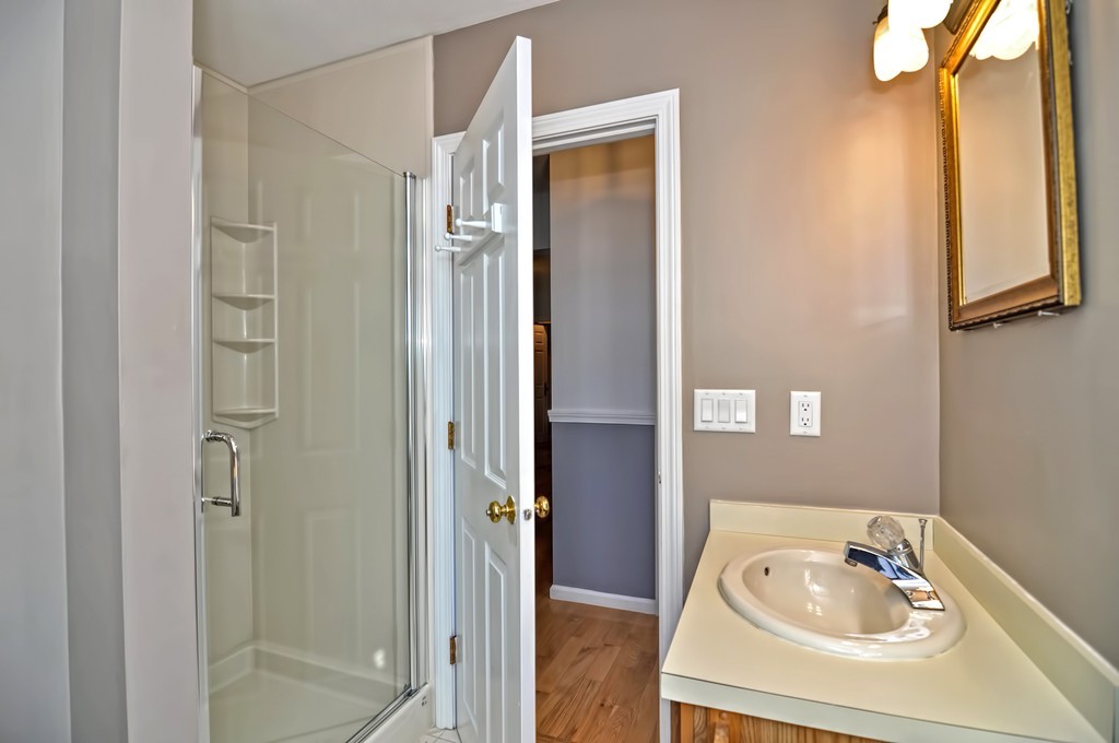 43 Stall Brook Road, Unit 43 Milford, MA 01757 - Photo 13 of 27 a bathroom with a tub and shower