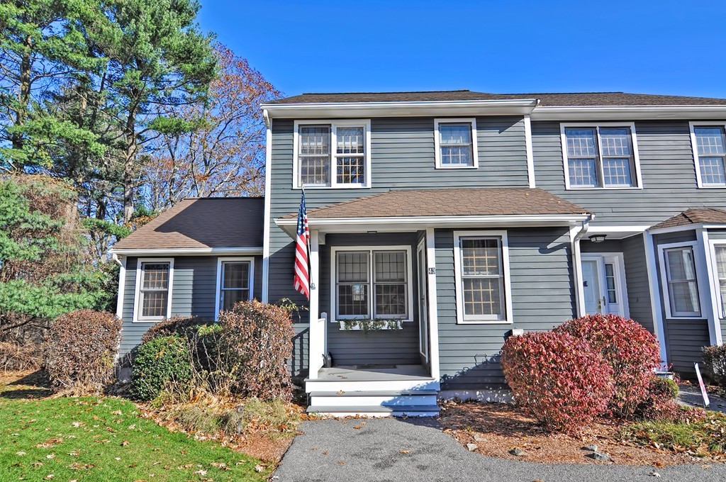 43 Stall Brook Road, Unit 43 Milford, MA 01757 - Photo 2 of 27 a front view of a house with garden