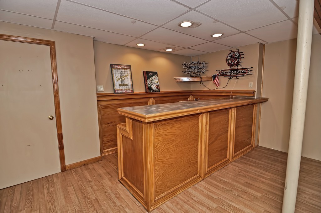 43 Stall Brook Road, Unit 43 Milford, MA 01757 - Photo 21 of 27 a kitchen with a sink and wooden floor