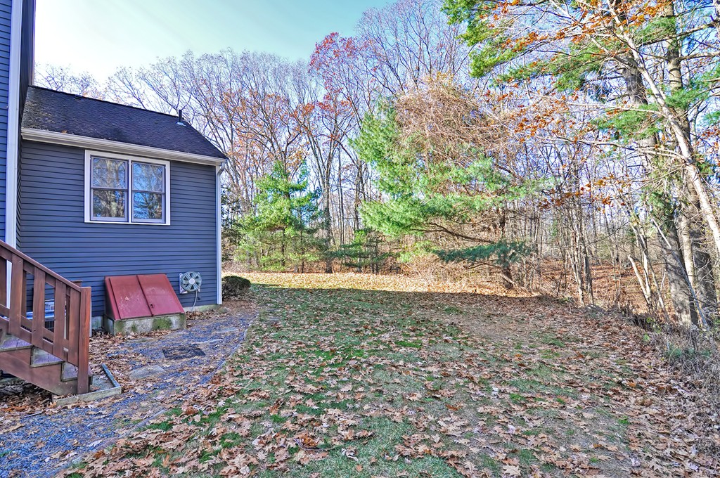 43 Stall Brook Road, Unit 43 Milford, MA 01757 - Photo 25 of 27 a view of a backyard with a tree