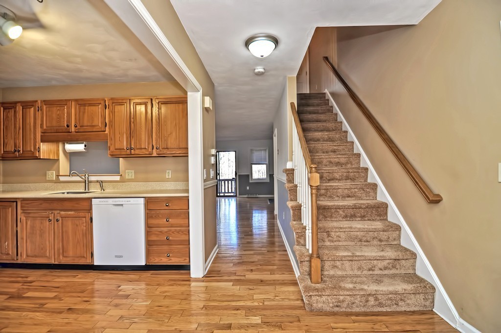 43 Stall Brook Road, Unit 43 Milford, MA 01757 - Photo 5 of 27 a view of kitchen with sink and cabinets