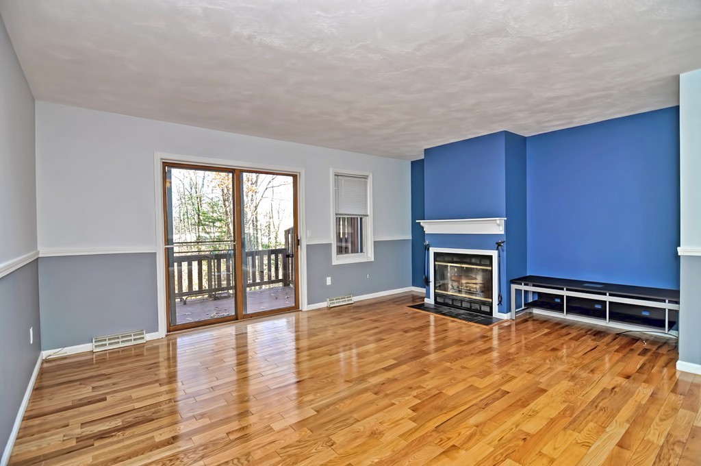 43 Stall Brook Road, Unit 43 Milford, MA 01757 - Photo 6 of 27 a view of livingroom with furniture and fireplace