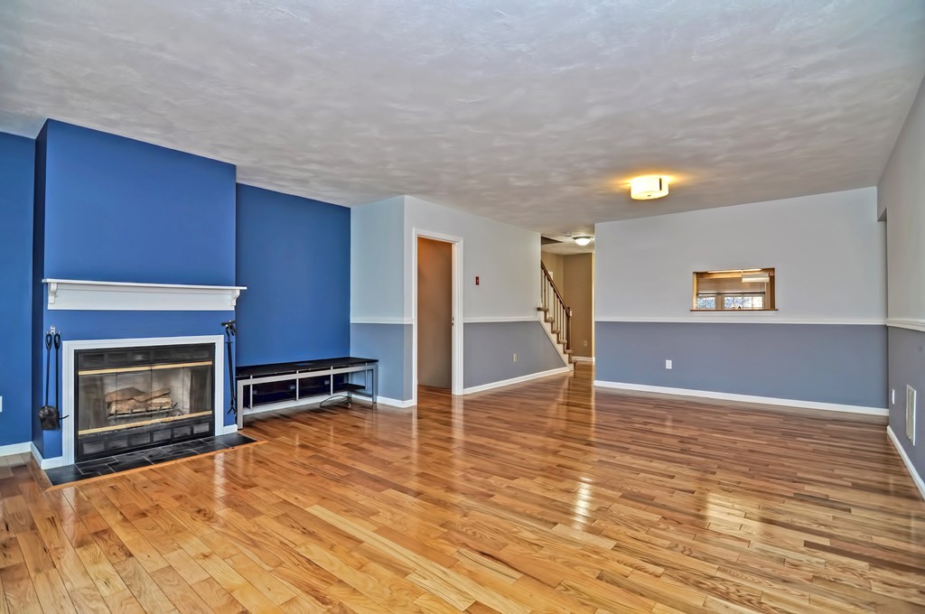43 Stall Brook Road, Unit 43 Milford, MA 01757 - Photo 8 of 27 a view of a livingroom with a fireplace