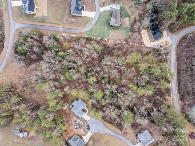 a aerial view of a house with a yard