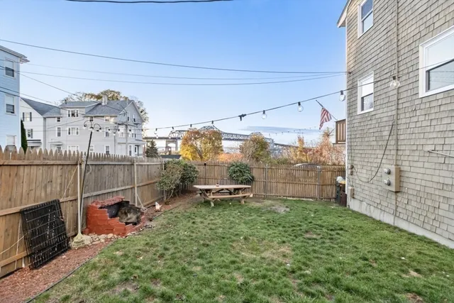 a view of roof deck with wooden floor and fence