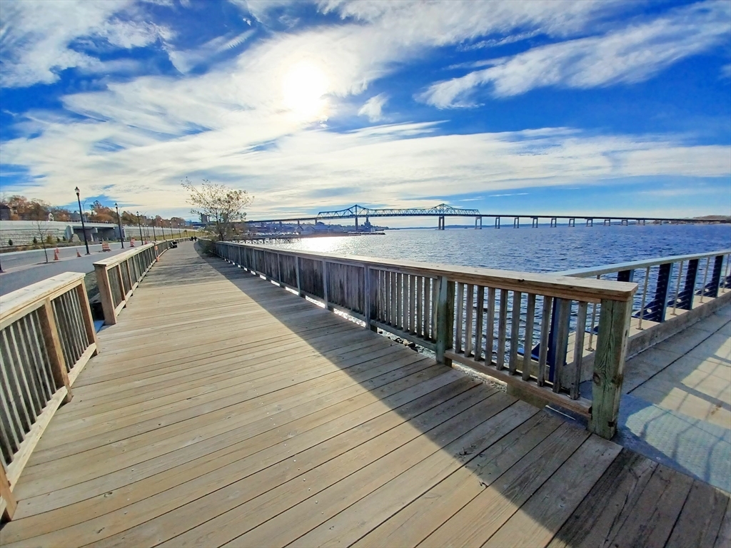 9 Doctor Street Fall River, MA 02720 - Photo 13 of 14 a view of roof deck with wooden floor and fence