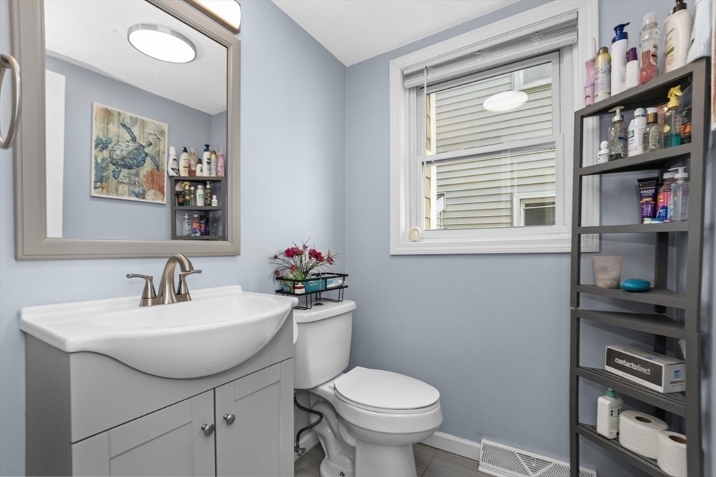 9 Doctor Street Fall River, MA 02720 - Photo 5 of 14 a bathroom with a toilet sink and mirror