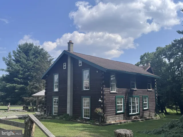 a view of a brick building next to a yard