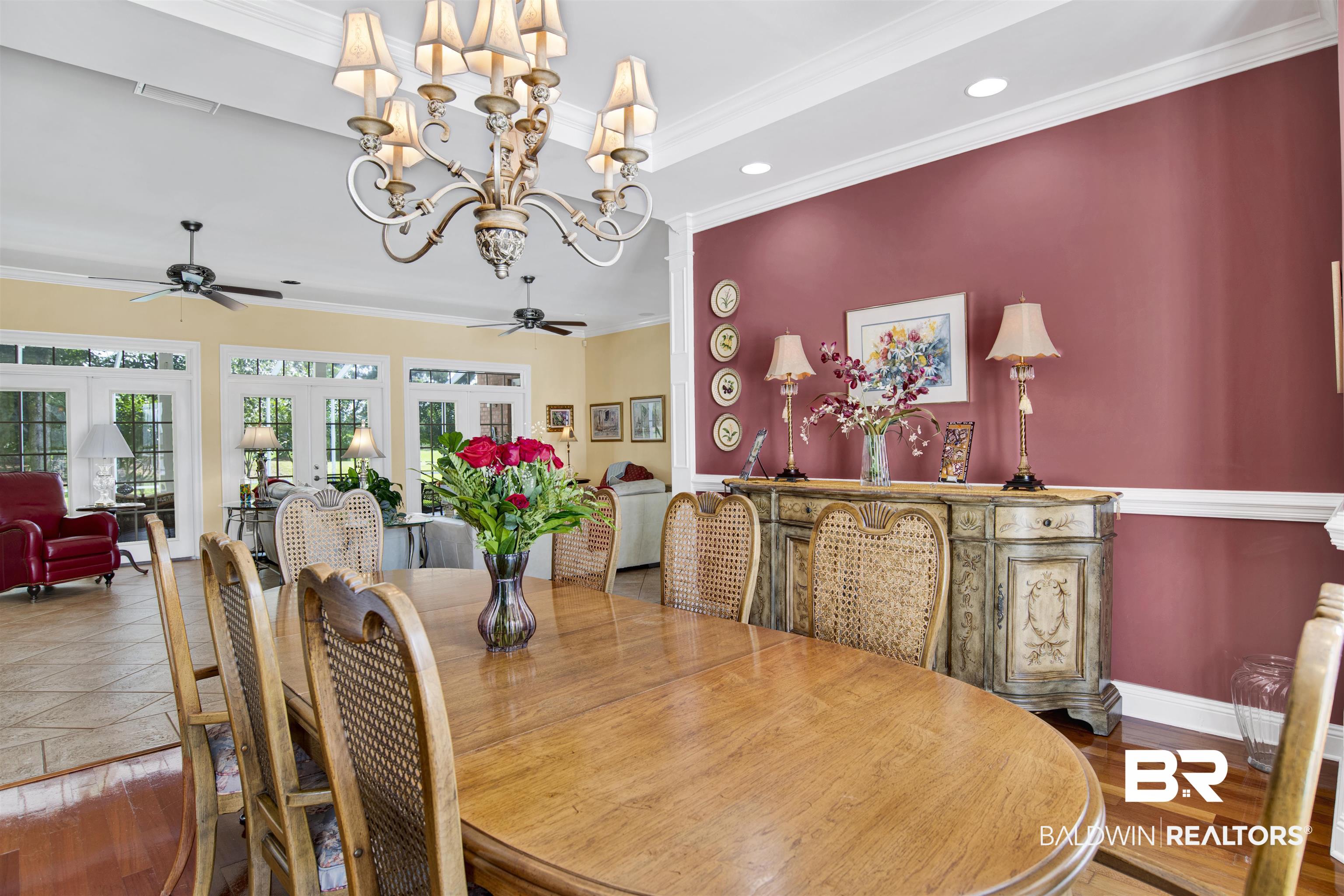 23014 Carnoustie Drive Foley, AL 36535 - Photo 18 of 49 Dining room featuring ornamental molding, a chandelier, wood finished floors, ceiling fan, and recessed lighting