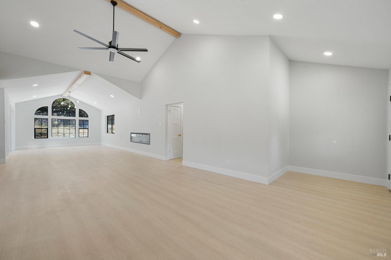 2129 Rockville Road Fairfield, CA 94534 - Photo 13 of 59 an empty room with ceiling fan and windows