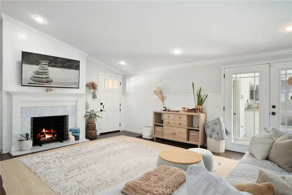 a kitchen with a sink stainless steel appliances and white cabinets