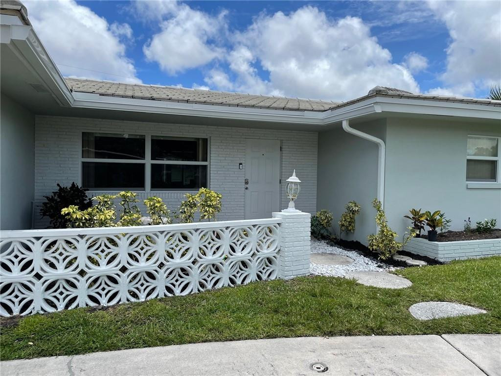 1248 Northwest 7th Street Boca Raton, FL 33486 - Photo 4 of 32 Entry Way with New Gutters
