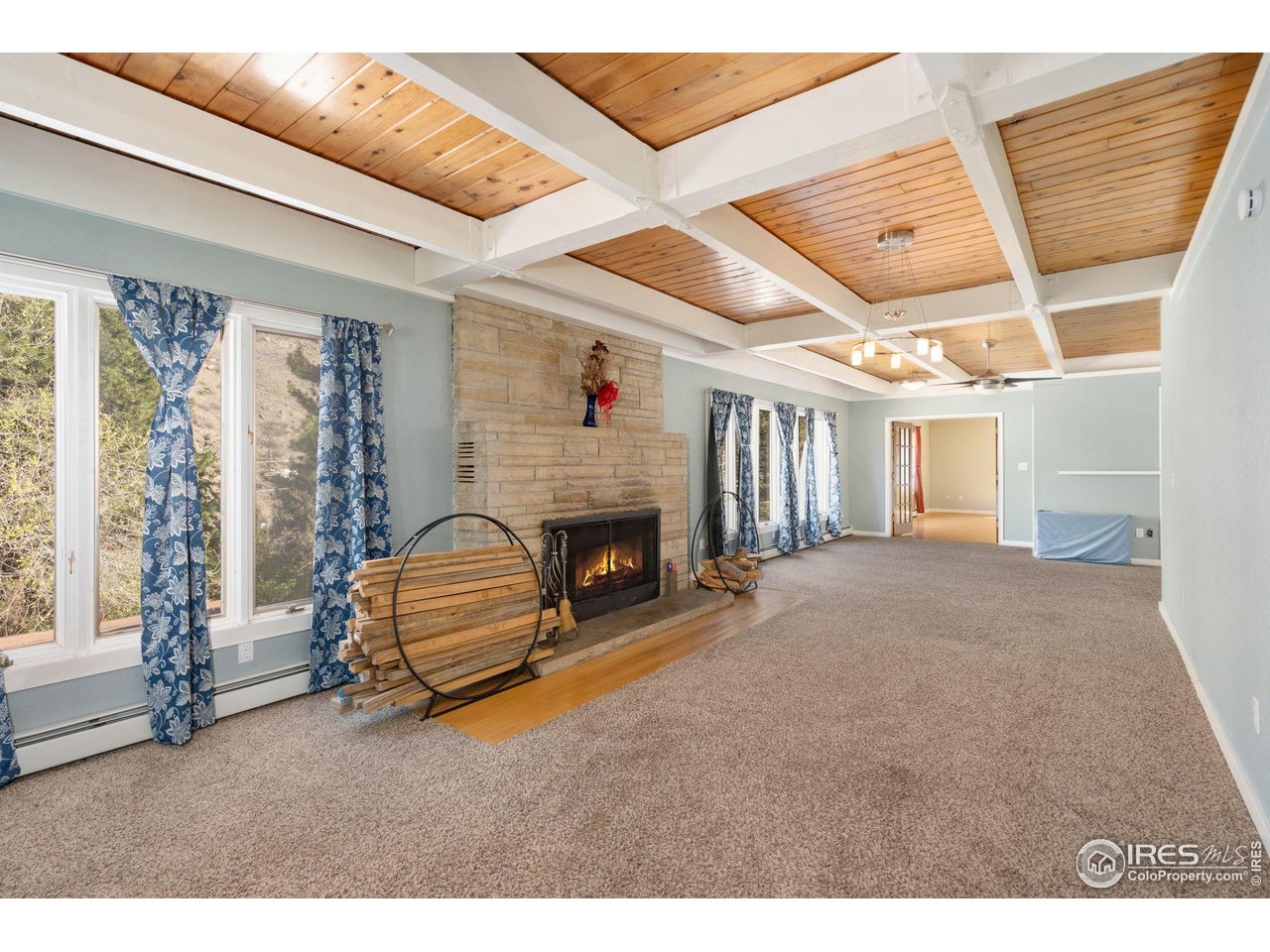 7301 Poudre Canyon Road Bellvue, CO 80512 - Photo 12 of 41 a room with furniture and a fireplace