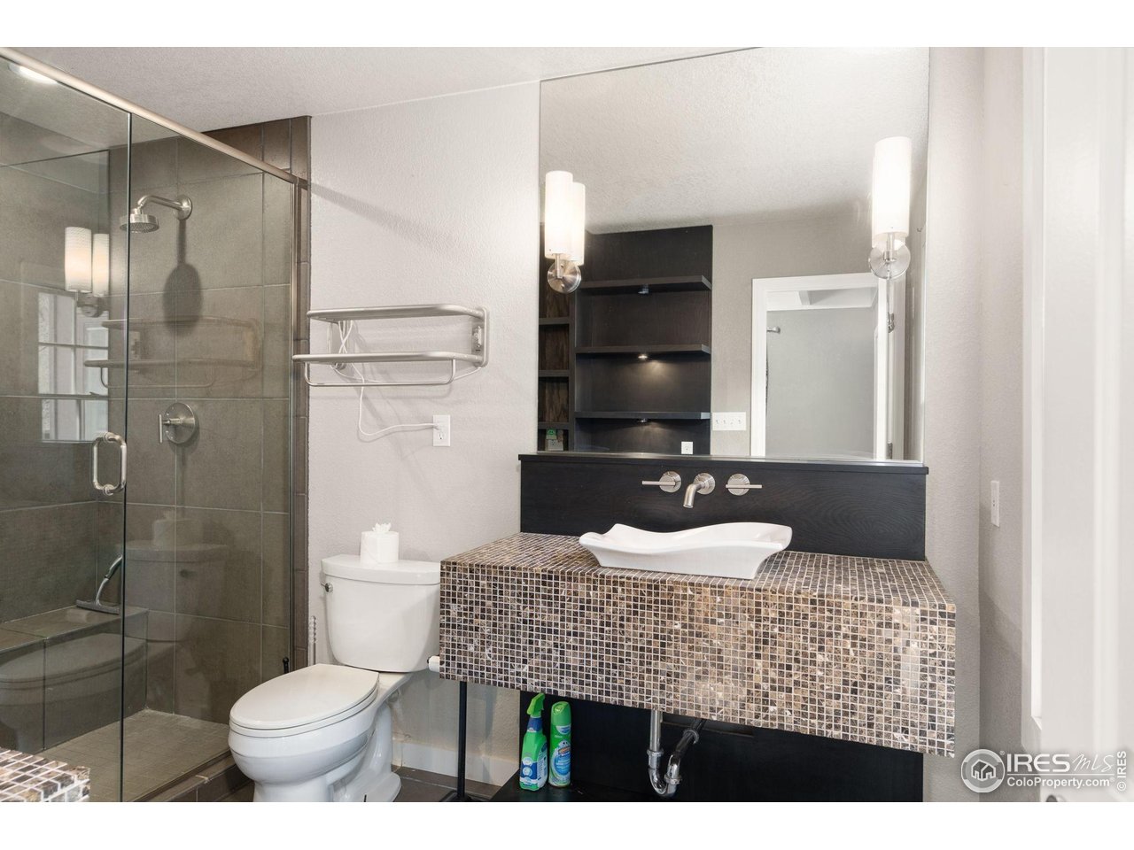 7301 Poudre Canyon Road Bellvue, CO 80512 - Photo 18 of 41 a bathroom with a granite countertop sink toilet and shower