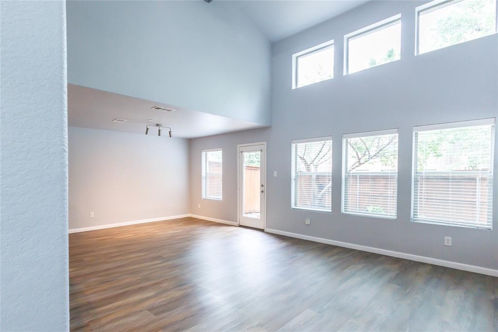 1124 Sophia Street Allen, TX 75013 - Photo 12 of 27 Spacious two story living room with high ceilings, large windows, and plenty of natural light