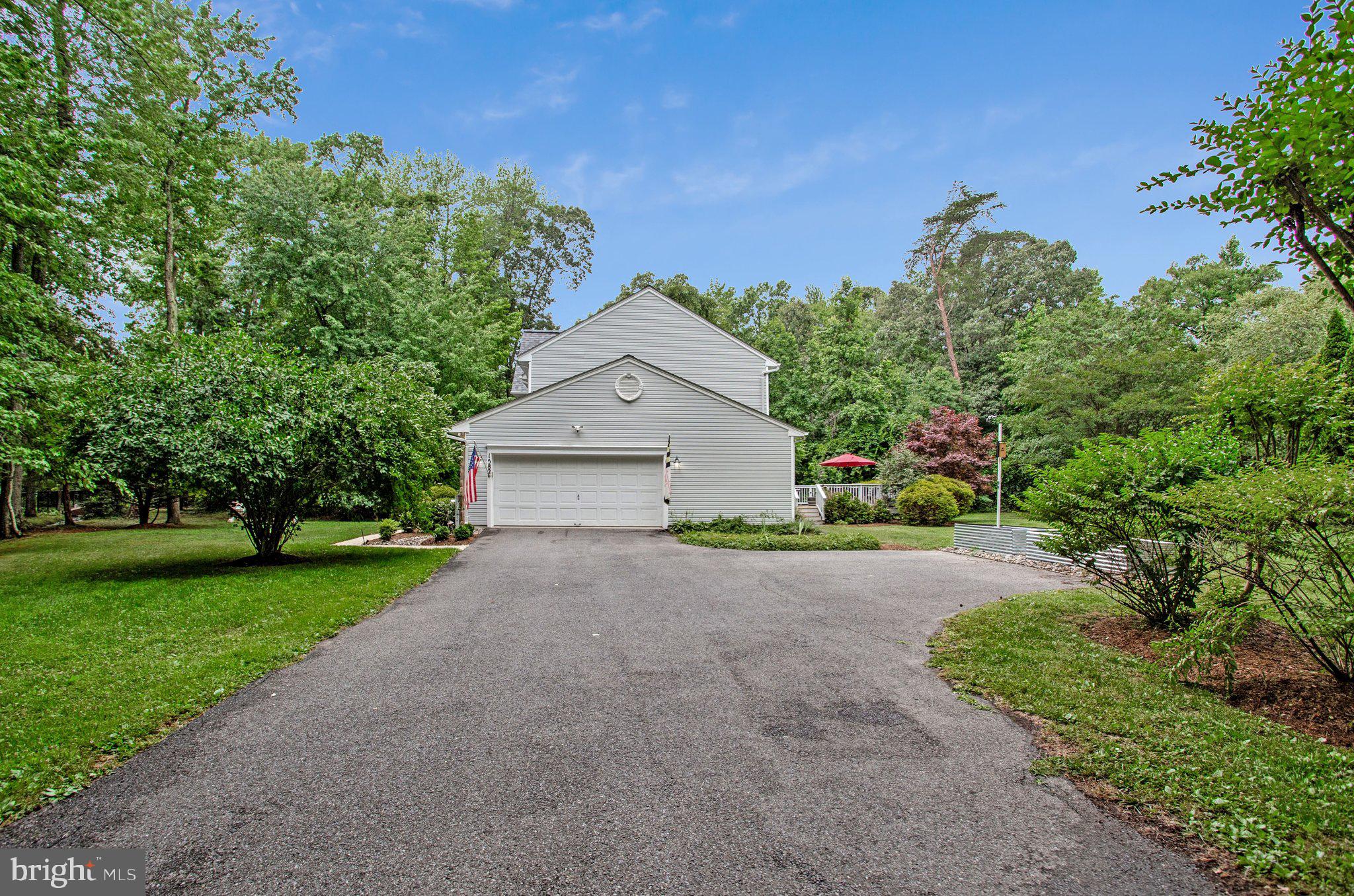 1582 Snug Harbor Road Shady Side, MD 20764 - Photo 10 of 53 Charming home nestled in lush greenery.
