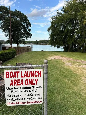 a sign on the side of the river