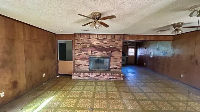 a view of a livingroom with a fireplace and furniture
