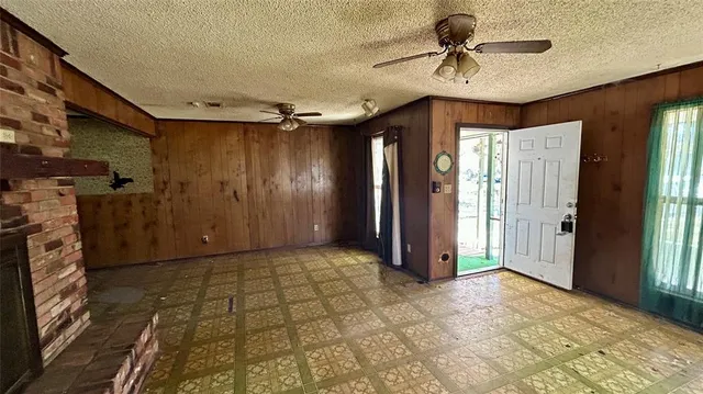 a view of a hallway with a chandelier