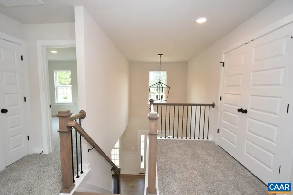 a view of a hallway with windows