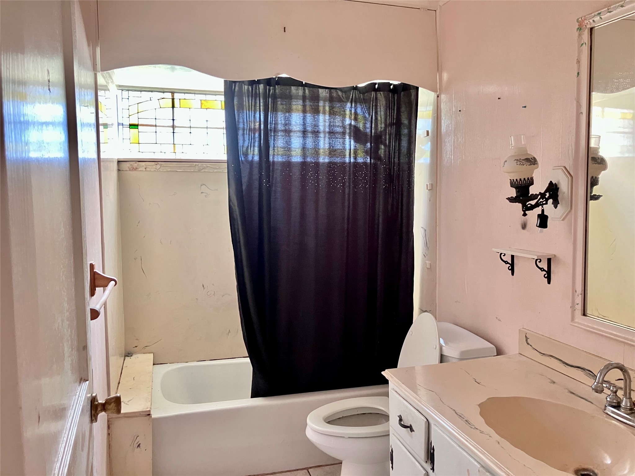5012 Winding Way Dickinson, TX 77539 - Photo 19 of 24 a bathroom with a sink toilet and shower