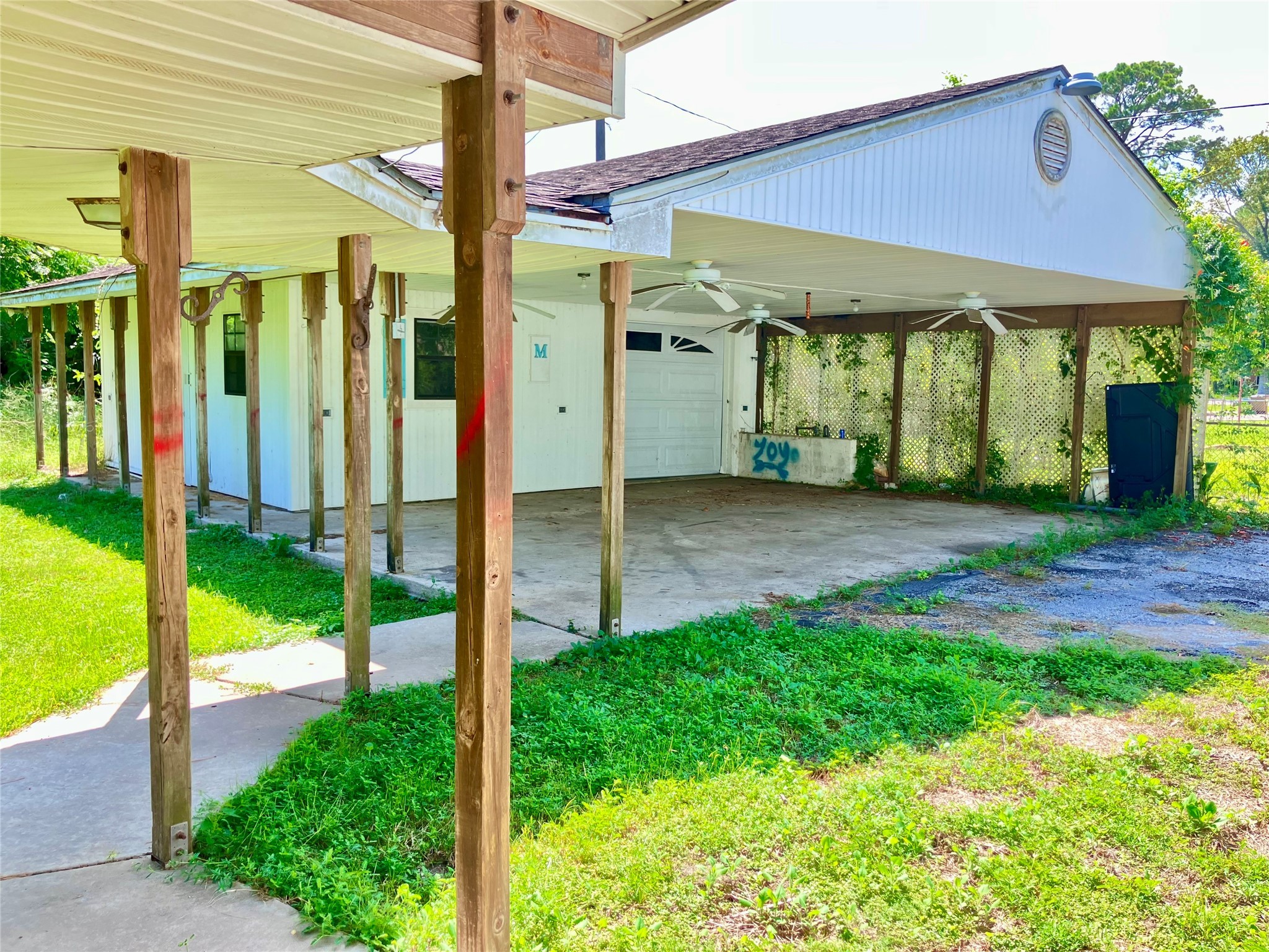 5012 Winding Way Dickinson, TX 77539 - Photo 2 of 24 a view of a house with backyard porch and garden