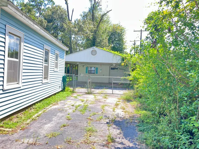 a house that has a tree in front of it