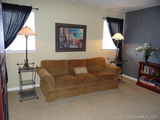 783 Knightswood Road Fort Mill, SC 29708 - Photo 2 of 17 a living room with furniture a lamp and a window