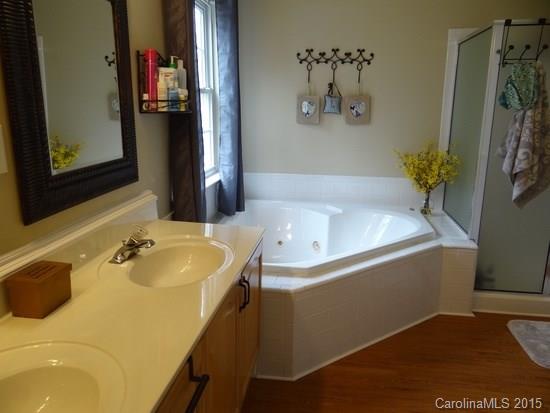 783 Knightswood Road Fort Mill, SC 29708 - Photo 12 of 17 a bathroom with a tub sink and mirror