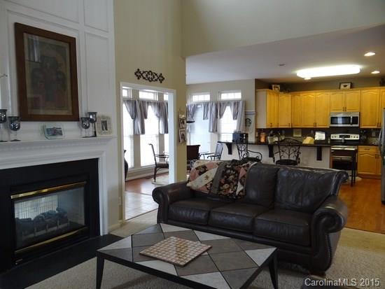 783 Knightswood Road Fort Mill, SC 29708 - Photo 5 of 17 a living room with furniture a fireplace and a flat screen tv