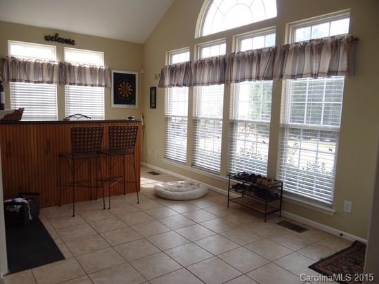 783 Knightswood Road Fort Mill, SC 29708 - Photo 6 of 17 a room with gym equipment and large windows
