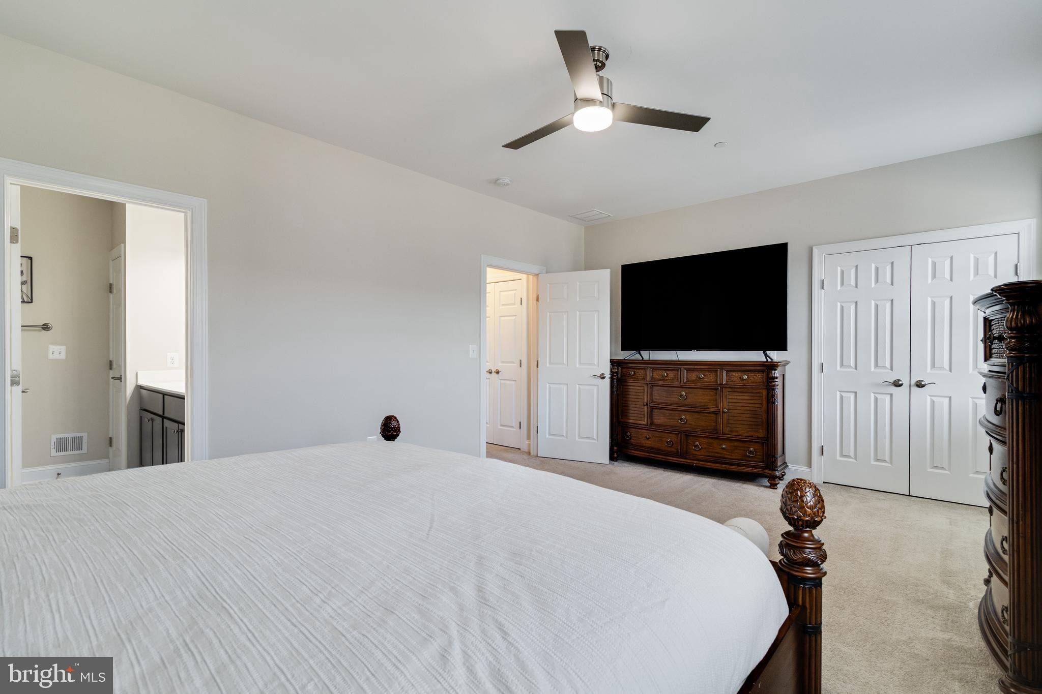 995 Rye Drive La Plata, MD 20646 - Photo 22 of 46 a bedroom with a bed and a flat screen tv