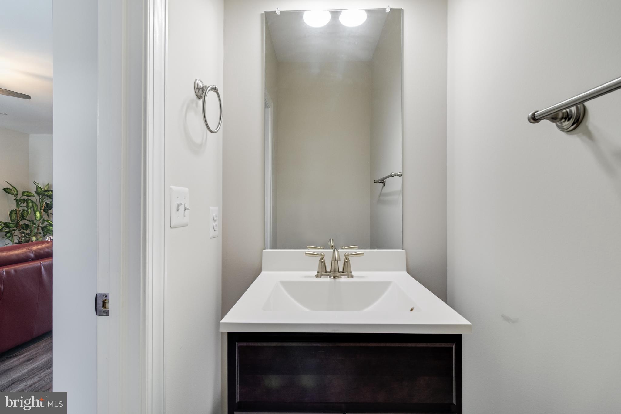 995 Rye Drive La Plata, MD 20646 - Photo 30 of 46 a bathroom with a sink and a mirror