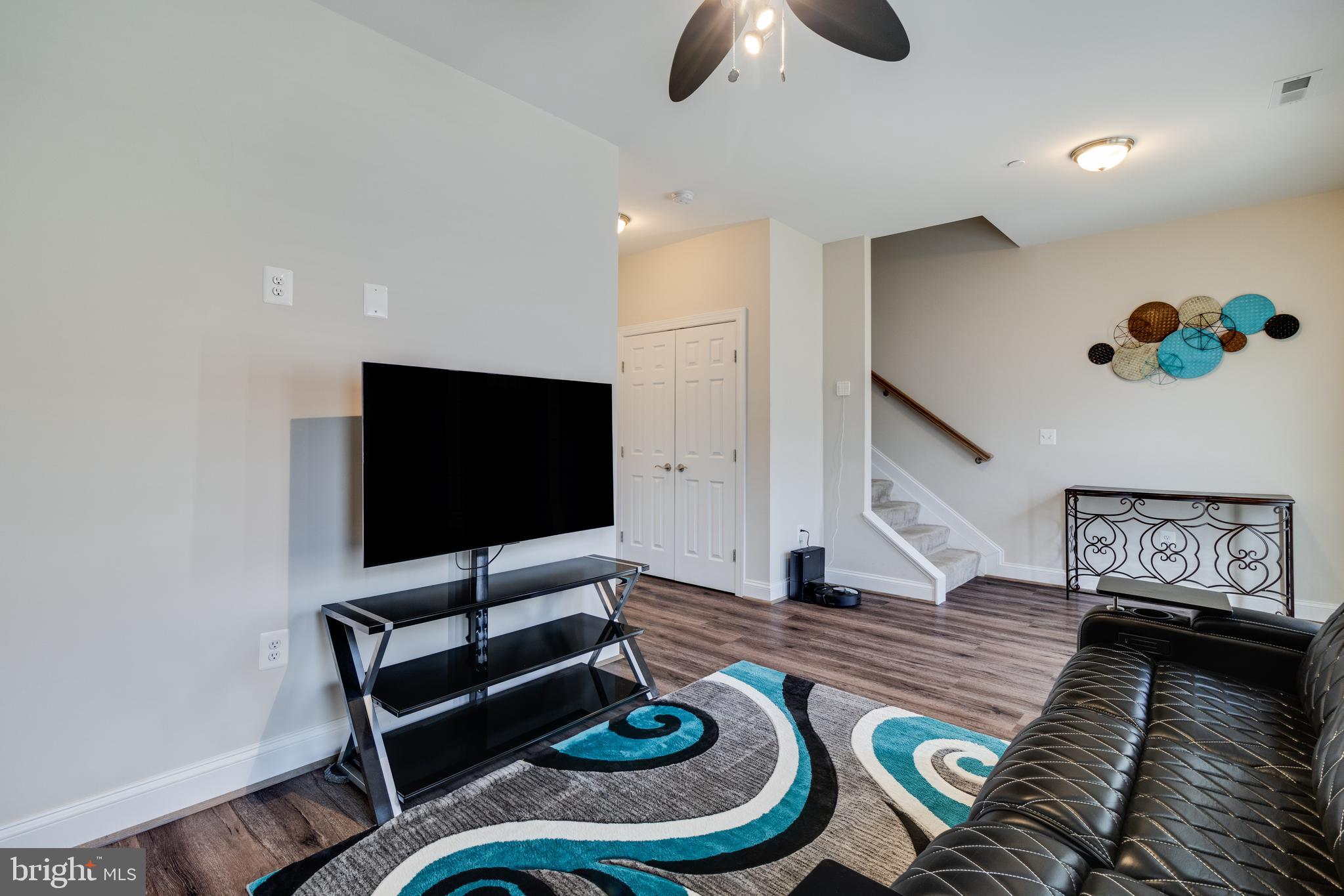 995 Rye Drive La Plata, MD 20646 - Photo 34 of 46 a living room with furniture and a flat screen tv