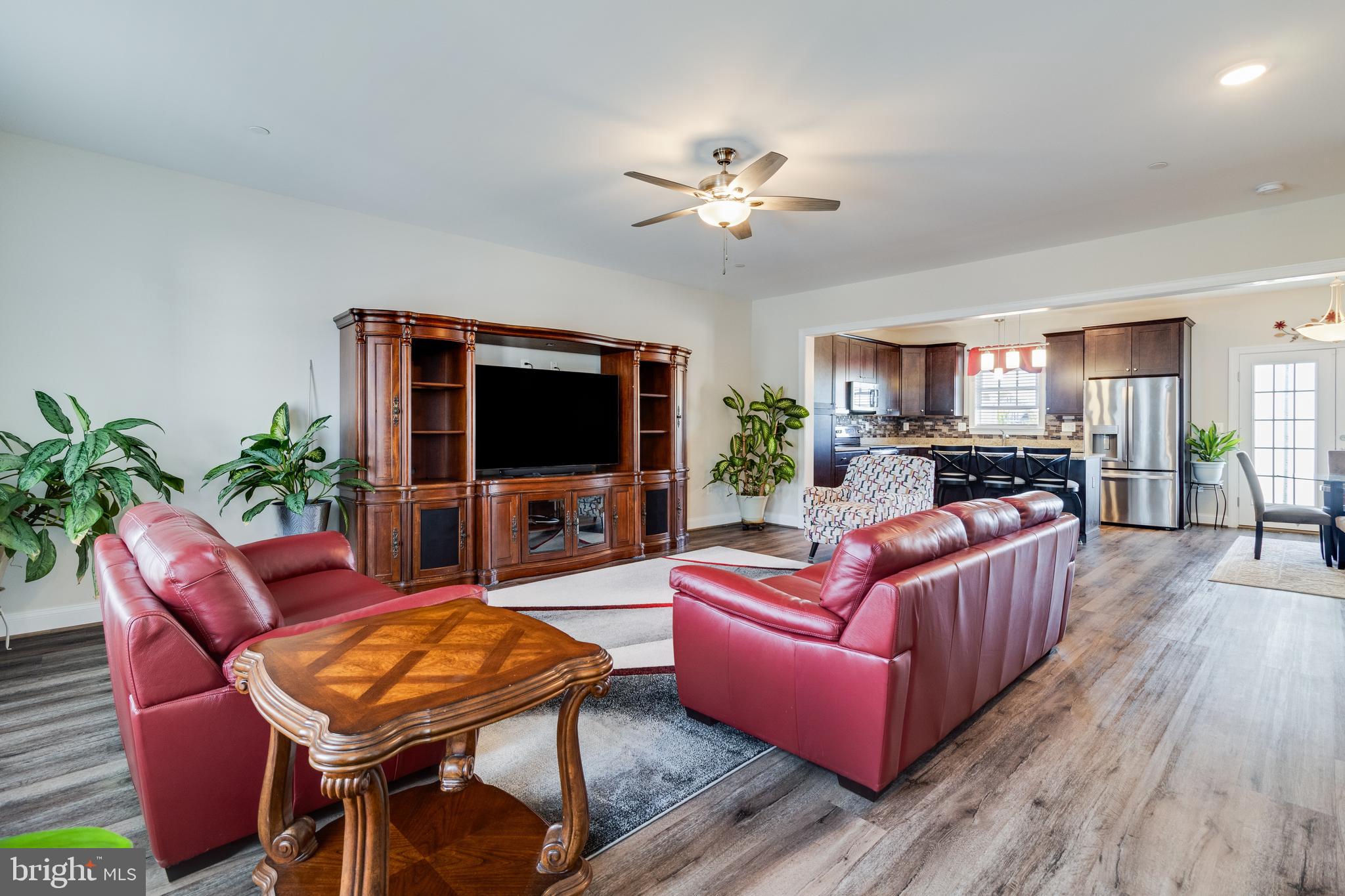 995 Rye Drive La Plata, MD 20646 - Photo 10 of 46 a living room with furniture a flat screen tv and a fireplace