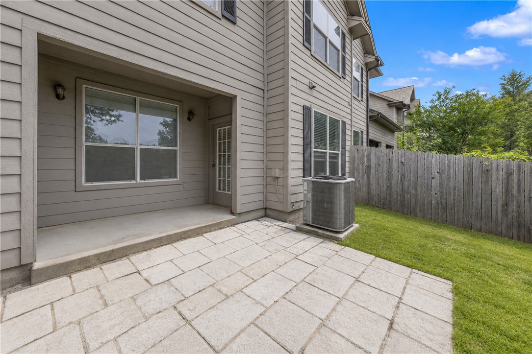 1425 West Villa Maria Road, Unit 1004 Bryan, TX 77801 - Photo 23 of 23 a view of backyard with barbeque grill and wooden fence