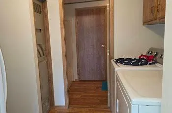 a kitchen with a refrigerator and cabinets