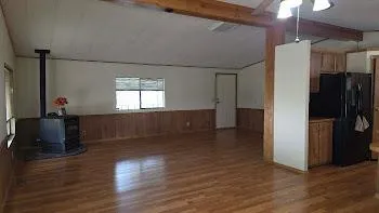 a view of a kitchen cabinets and wooden floor
