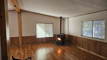 a view of a livingroom with furniture and a window