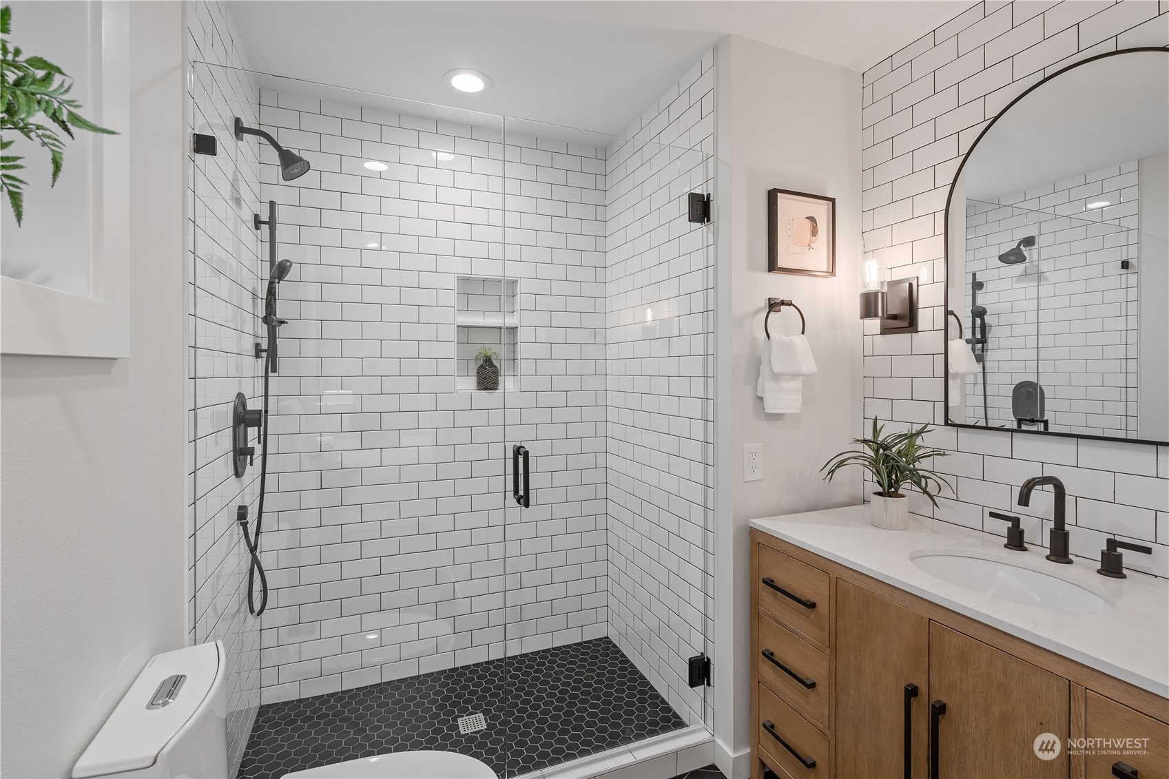3541 Southwest 100th Street Seattle, WA 98146 - Photo 13 of 25 a bathroom with a sink a toilet and shower