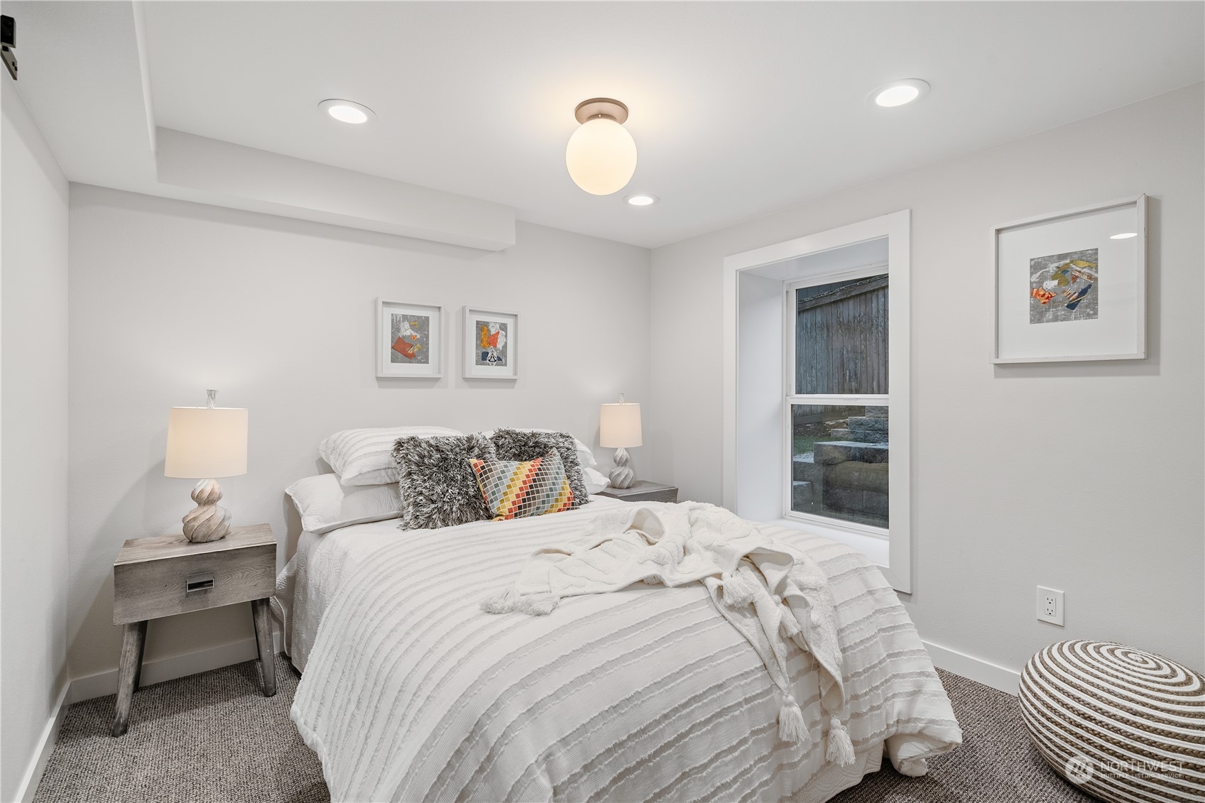 3541 Southwest 100th Street Seattle, WA 98146 - Photo 16 of 25 a bedroom with a bed and a lamp