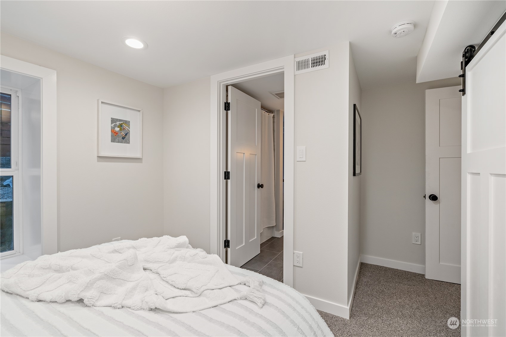3541 Southwest 100th Street Seattle, WA 98146 - Photo 17 of 25 a bedroom with a bed and hallway