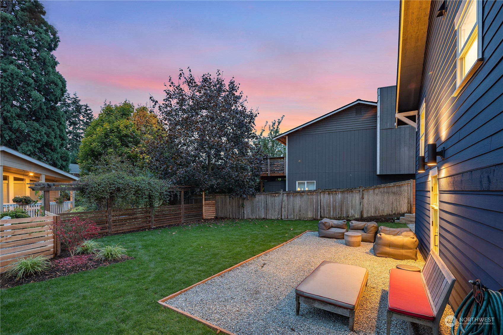 3541 Southwest 100th Street Seattle, WA 98146 - Photo 22 of 25 a backyard of a house with table and chairs