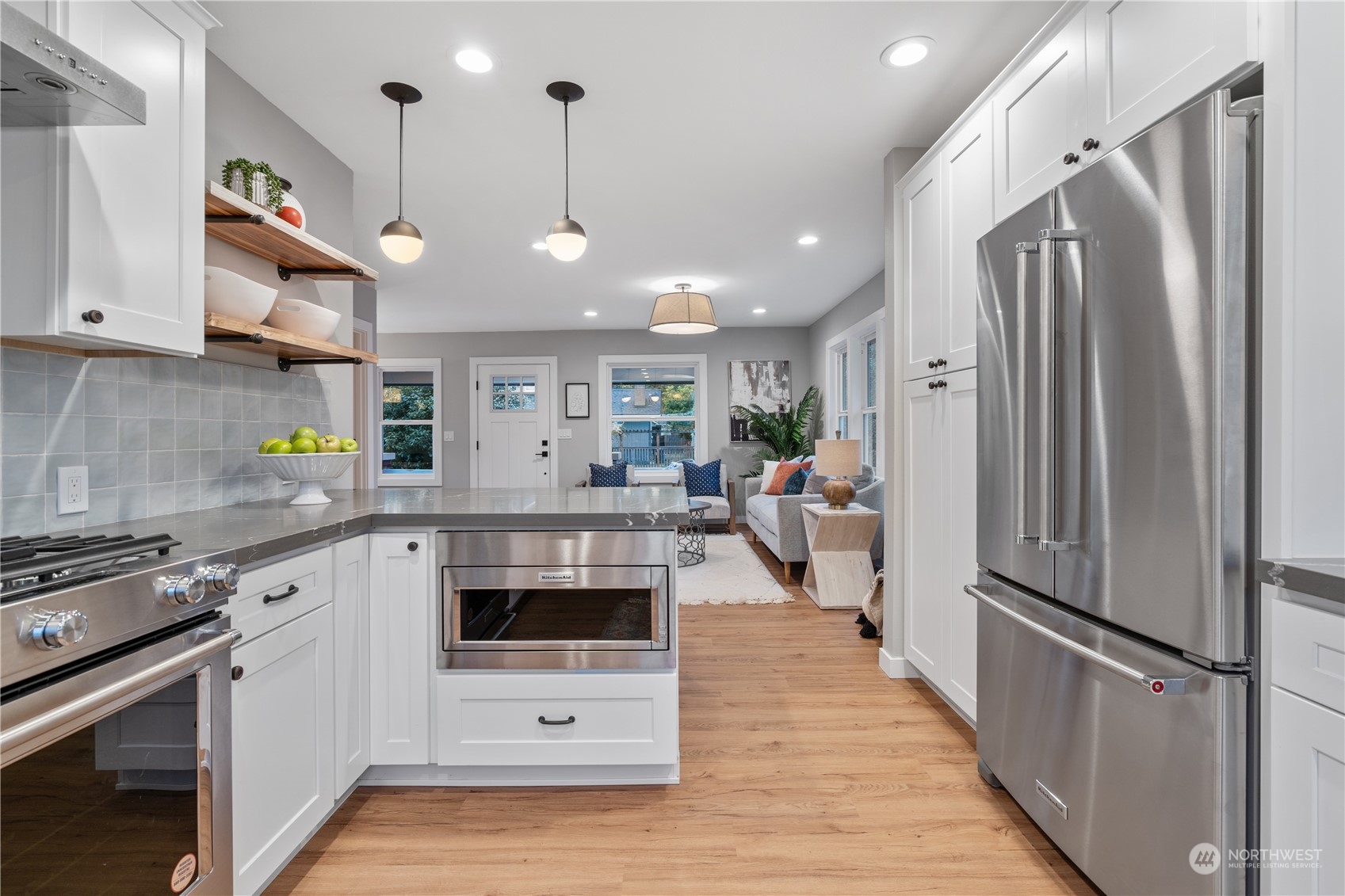 3541 Southwest 100th Street Seattle, WA 98146 - Photo 7 of 25 a kitchen with stainless steel appliances a stove a refrigerator and a sink
