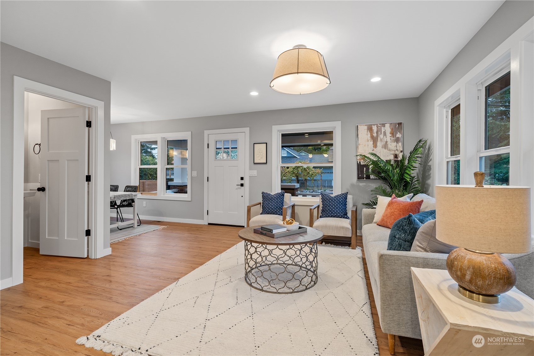 3541 Southwest 100th Street Seattle, WA 98146 - Photo 9 of 25 a living room with furniture potted plant and a large window