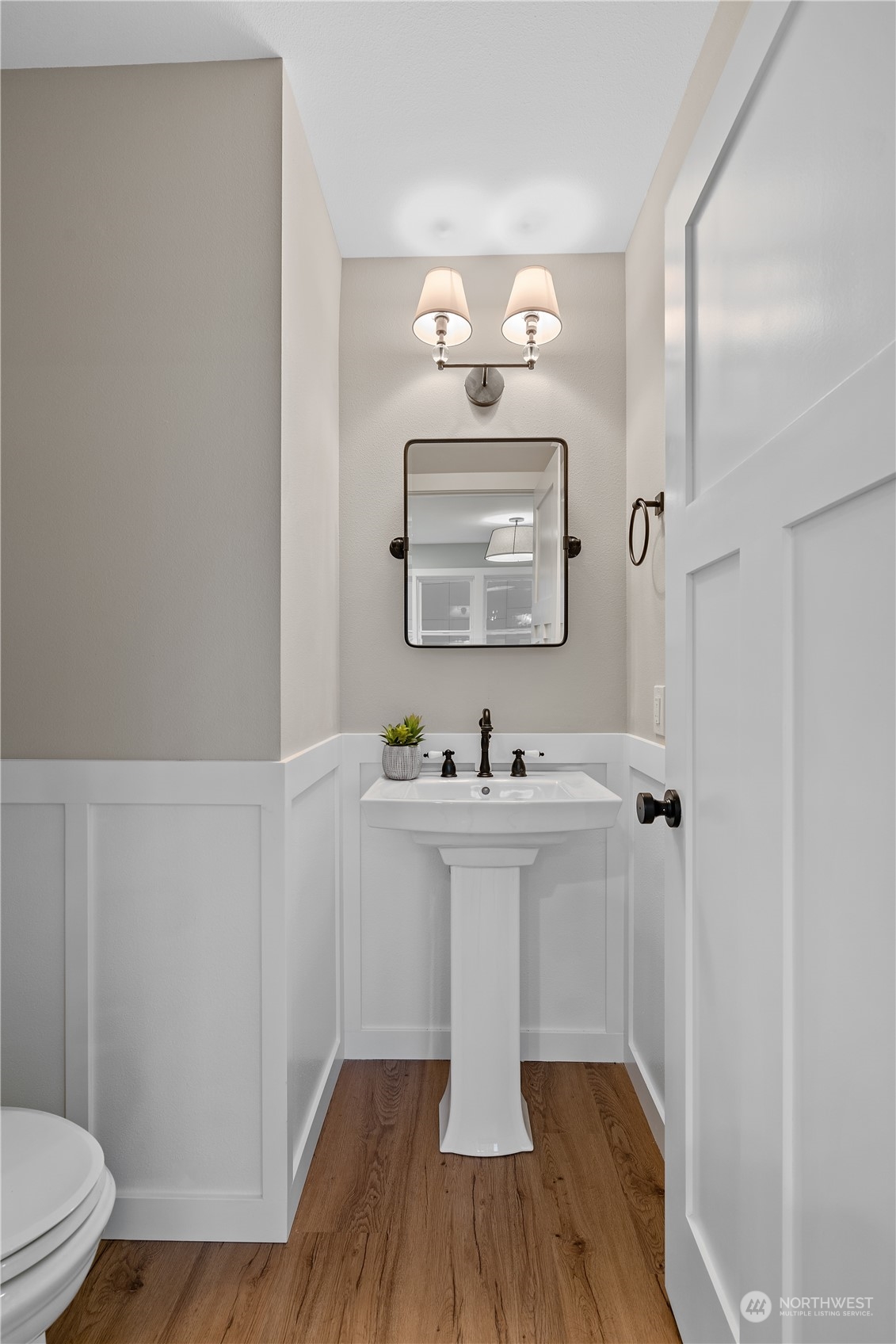 3541 Southwest 100th Street Seattle, WA 98146 - Photo 10 of 25 a bathroom with a sink a toilet a mirror and shower