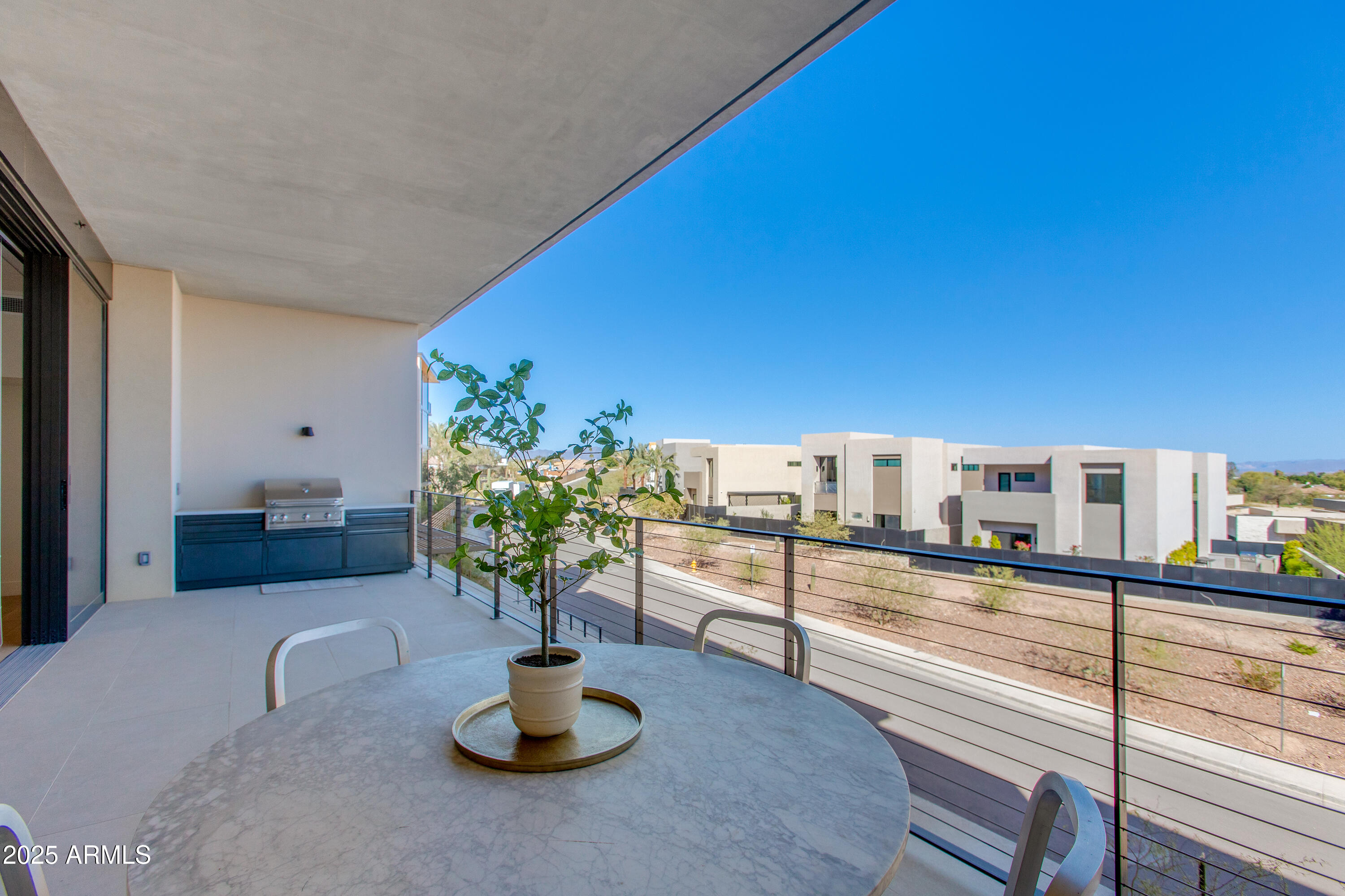 5000 North Camelback Ridge Drive, Unit 206 Scottsdale, AZ 85251 - Photo 40 of 62 a kitchen with a table and chairs