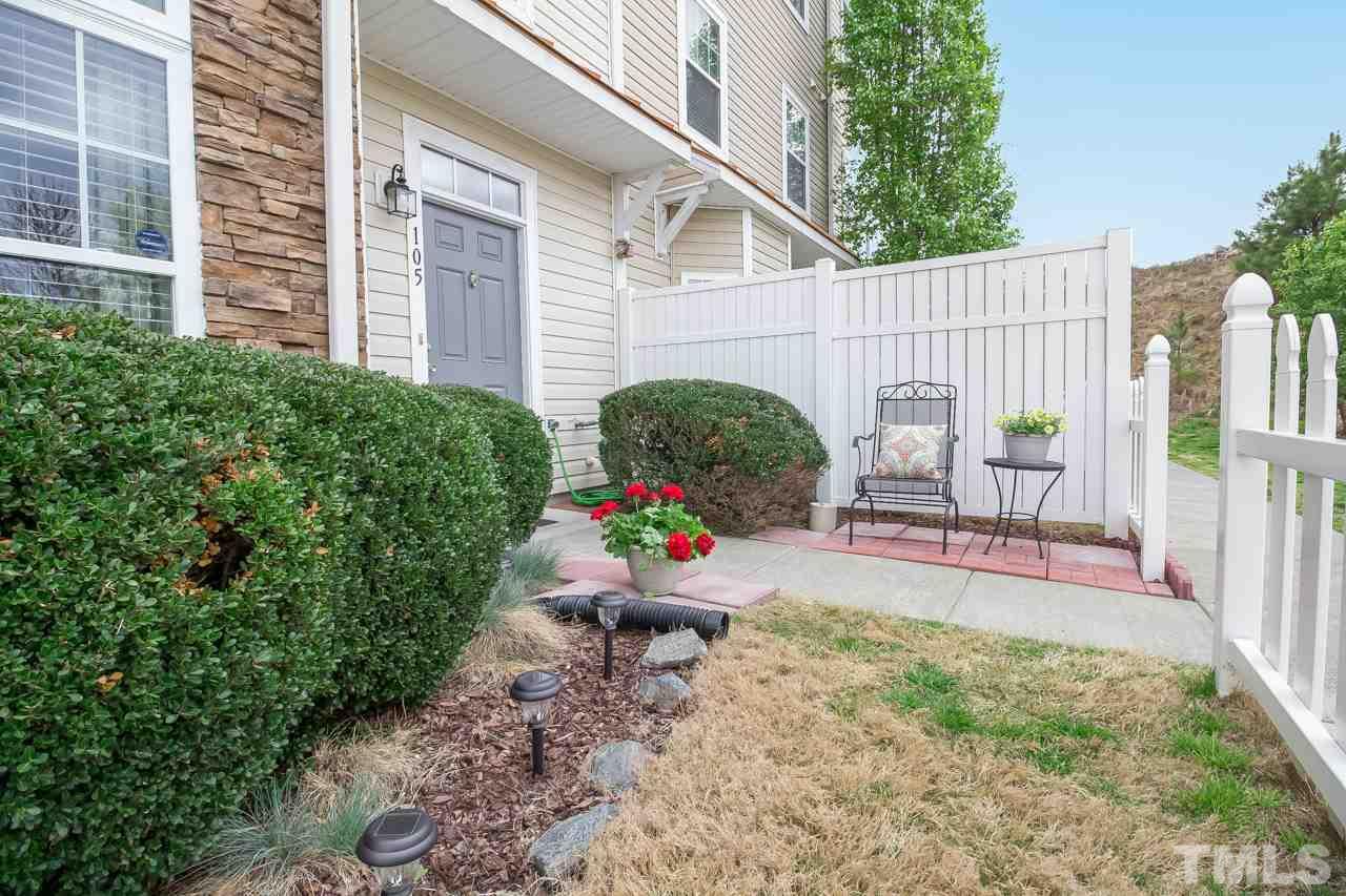 11701 Coppergate Drive, Unit 105 Raleigh, NC 27614 - Photo 2 of 25 Front courtyard is partially fenced. A relaxing spot for your morning coffee or your grill.