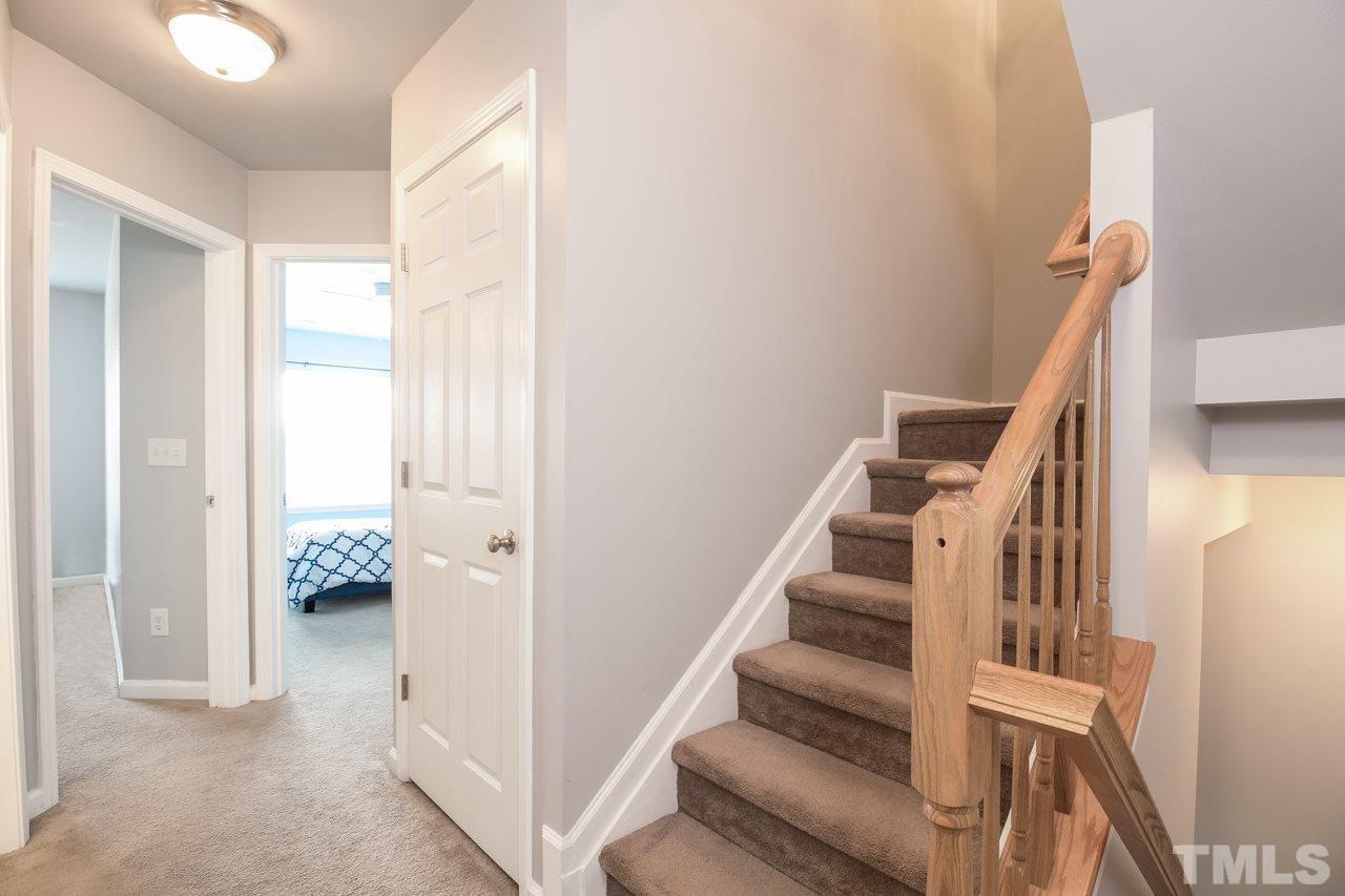11701 Coppergate Drive, Unit 105 Raleigh, NC 27614 - Photo 12 of 25 A view of the staircase and hallway on the second floor.