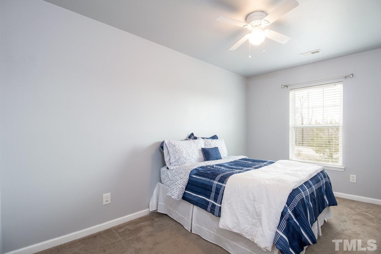 11701 Coppergate Drive, Unit 105 Raleigh, NC 27614 - Photo 14 of 25 Other second floor bedroom has relaxing gray paint.